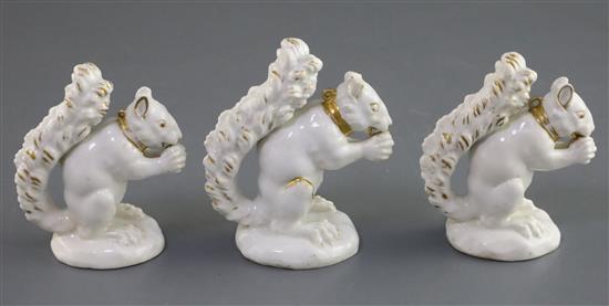 Three Derby porcelain figures of a squirrel, c.1800-30, H. 8.2cm and 9.2cm, faults